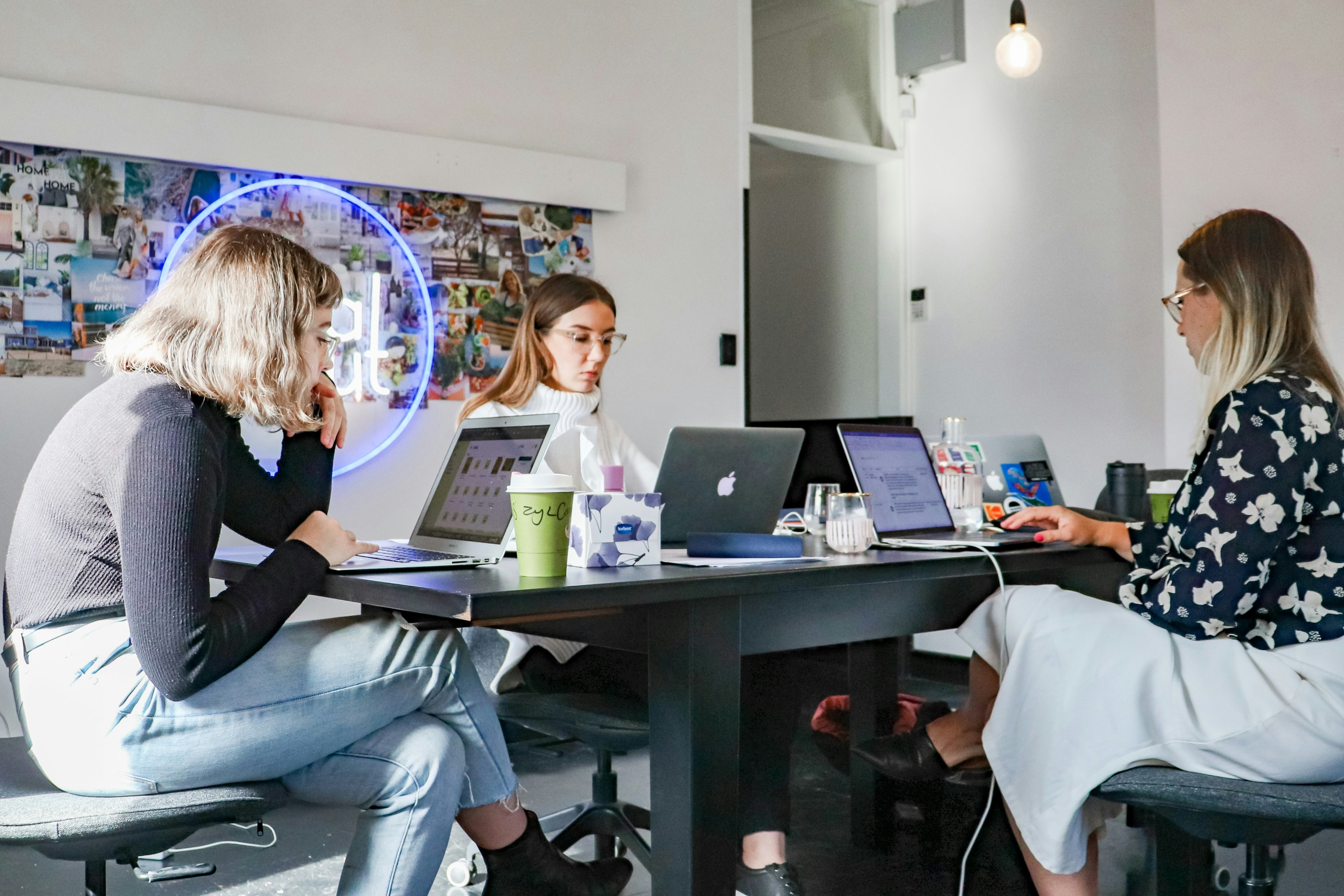 Real estate marketing team meets to combine both digital and print strategies.