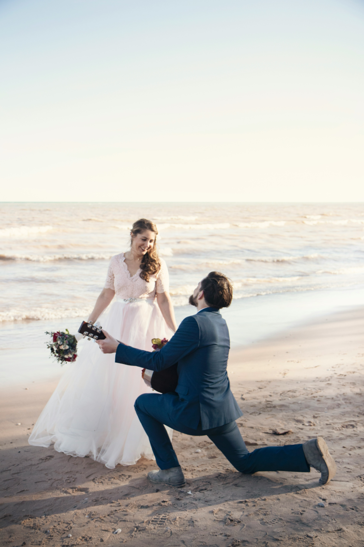 https://unsplash.com/photos/man-kneeling-on-seashore-and-playing-guitar-in-front-of-woman-at-daytime-8OAaIV_L2Q0