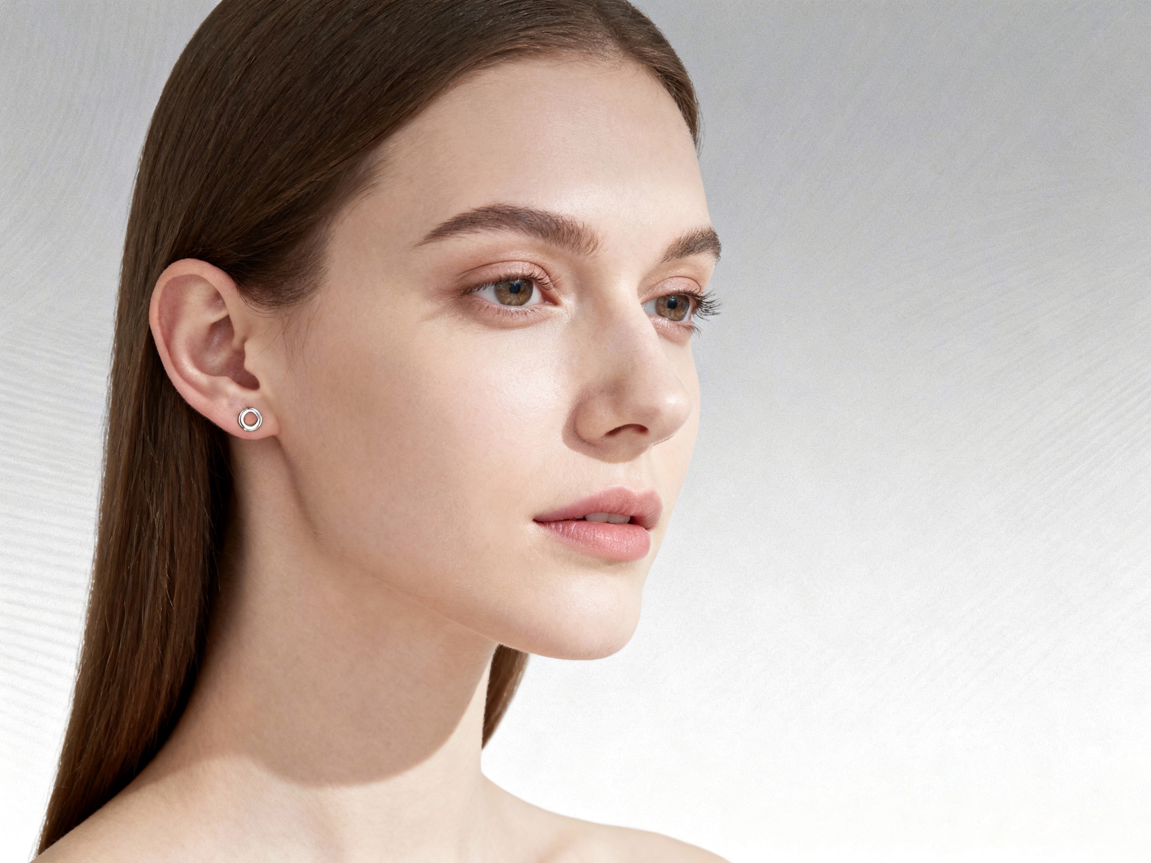 Simply styled silver flat stud earrings.