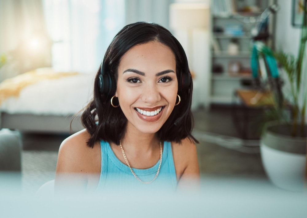 A female call center customer service using remote data centers for support with a cloud phone system.