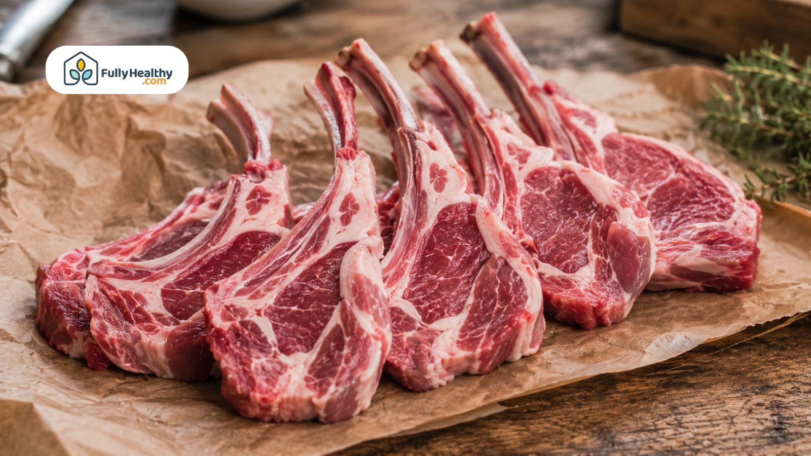 Fresh raw lamb chops on butcher paper with visible marbling.