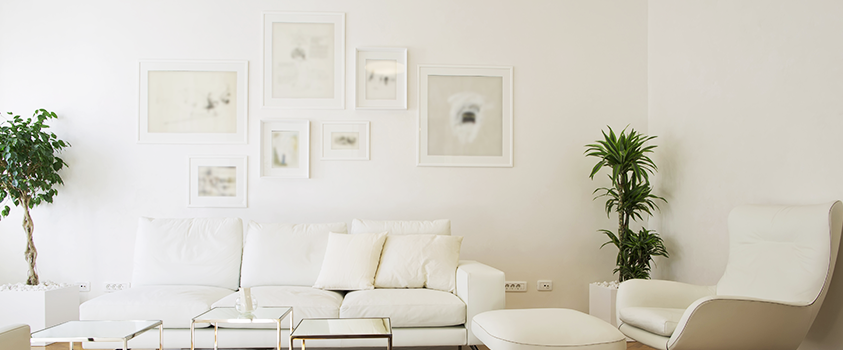 White frames on a white wall give the room a real sense of space and give the artwork inside a chance to shine.
