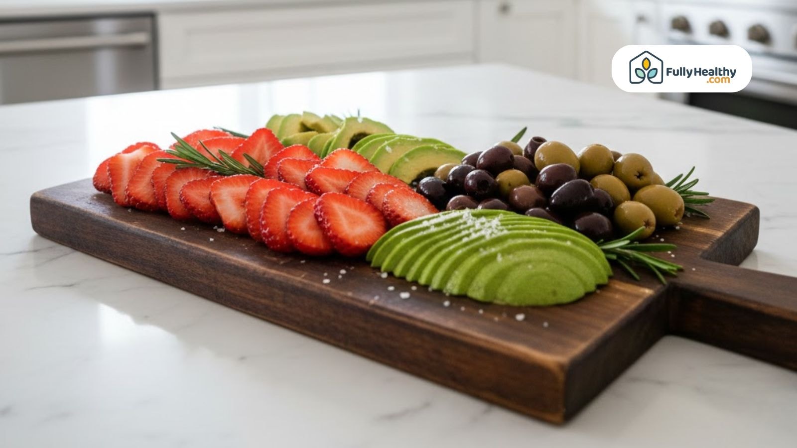 Low carb fruit board with strawberries, avocado, olives, and grapes.
