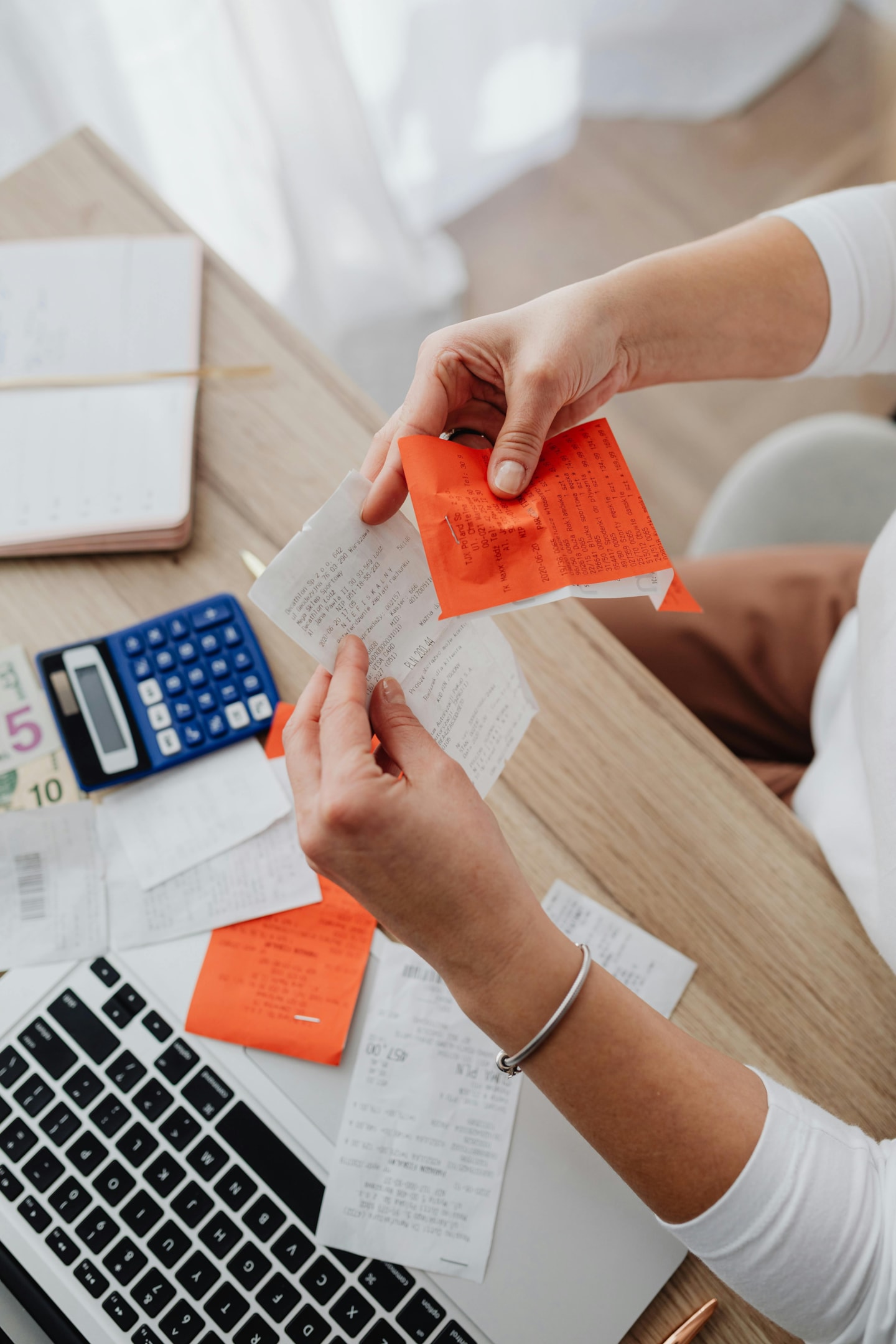 Tax professional reviews receipts of client who tracks their deductions.