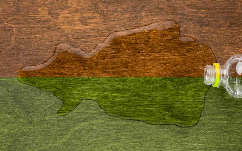 Water spilling on a wooden table