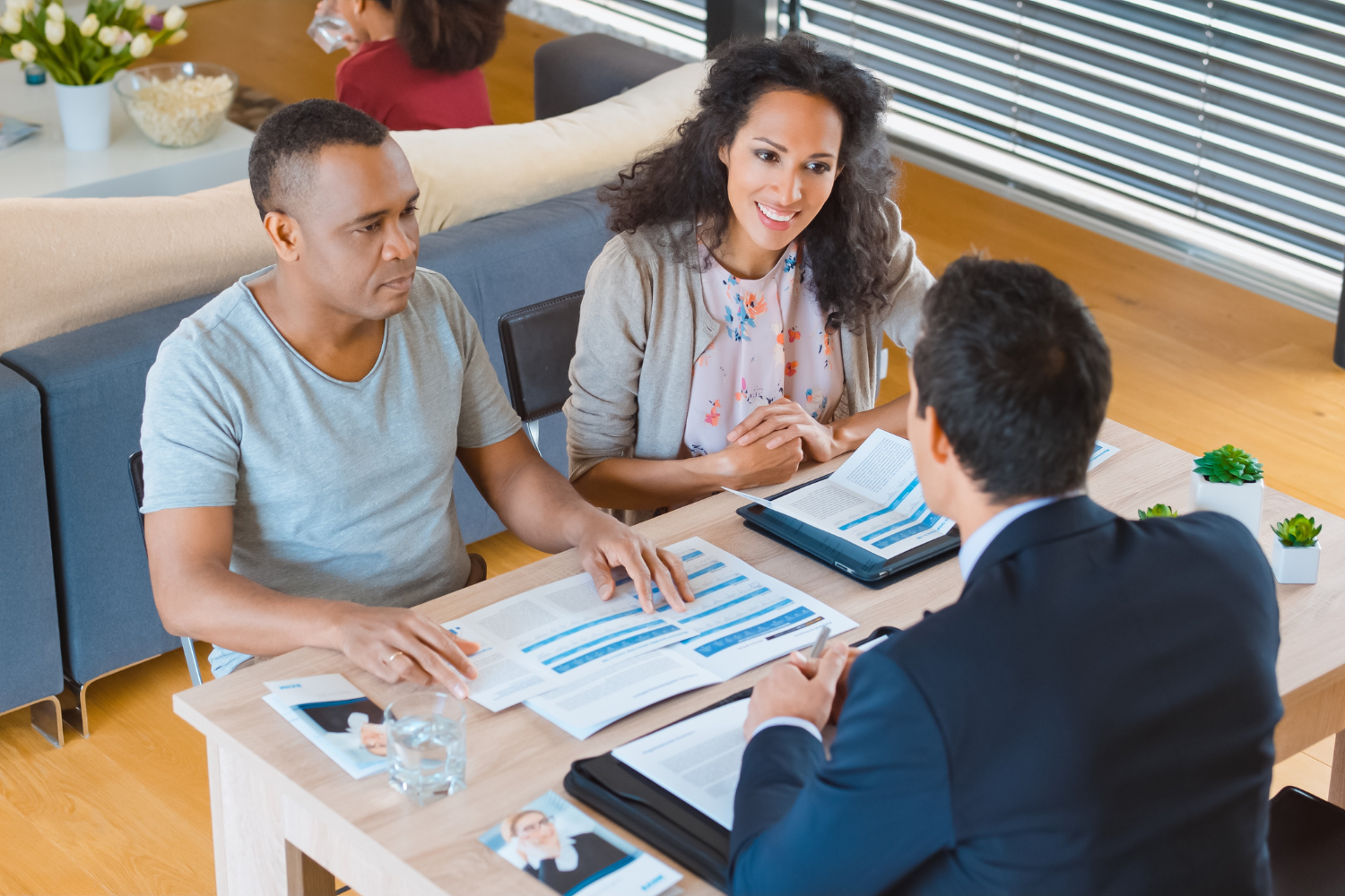 A CPA, banker, and business owner in a meeting.