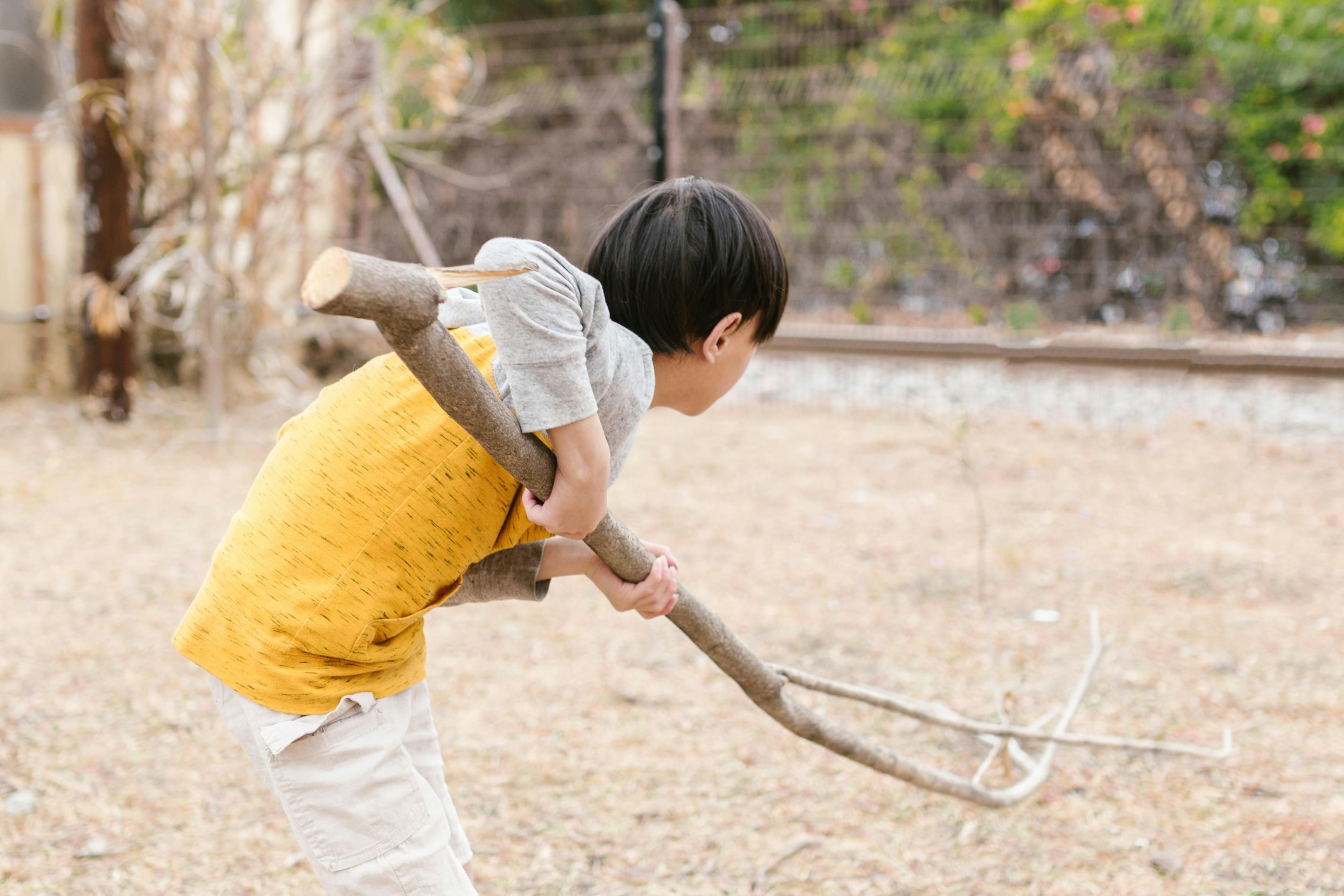 Photo by RDNE Stock project: https://www.pexels.com/photo/kid-playing-outside-holding-a-twig-8297634/