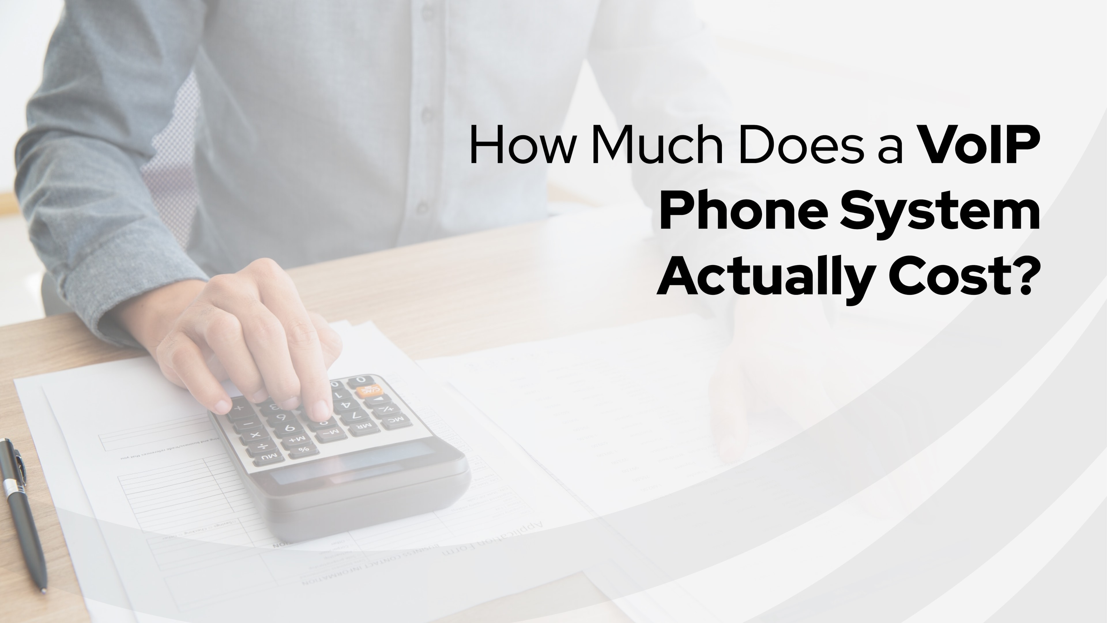 A person pricing out a unified communications platform from Simplicity VoIP, sorting through papers and looking thoughtful.