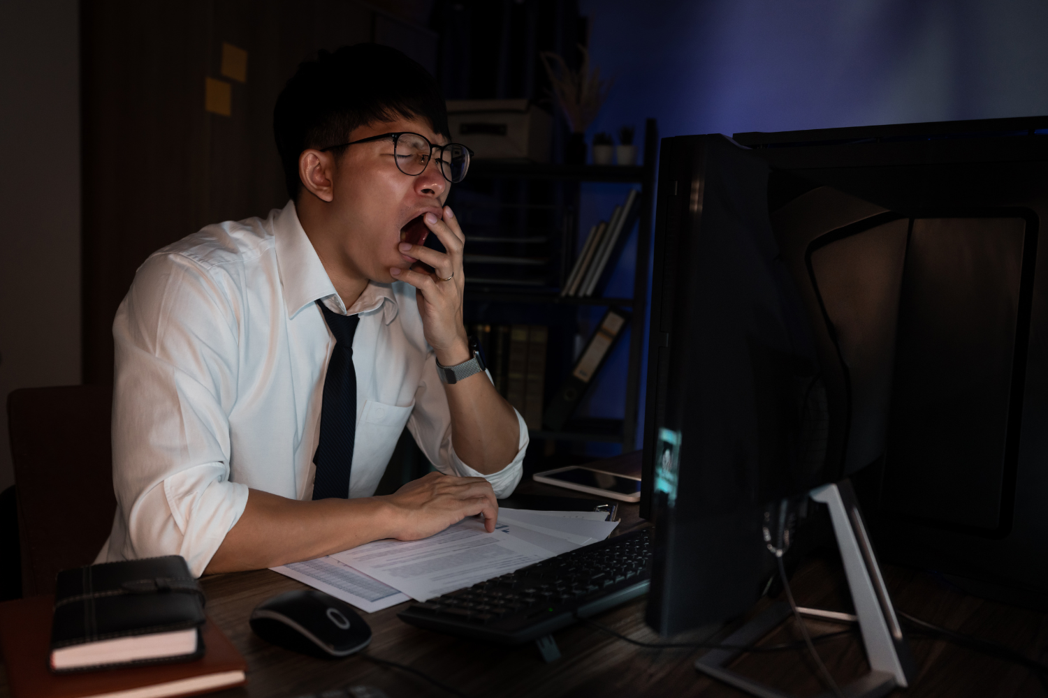 A tired employee working at night.