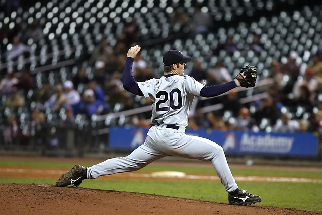 a pitcher throwing a pitch in an MLB game