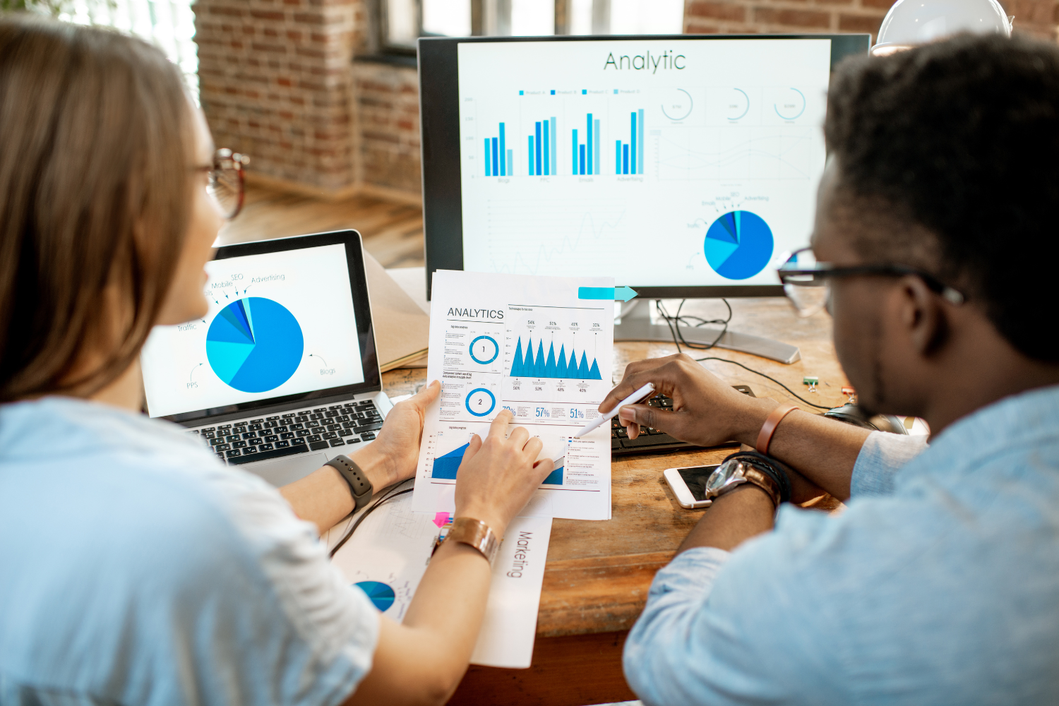Businesspersons analyzing charts and feedback data.