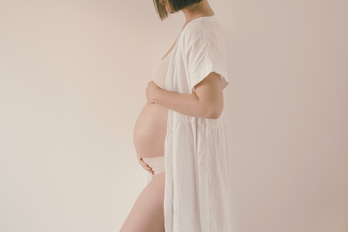 Pregnant woman wearing a robe