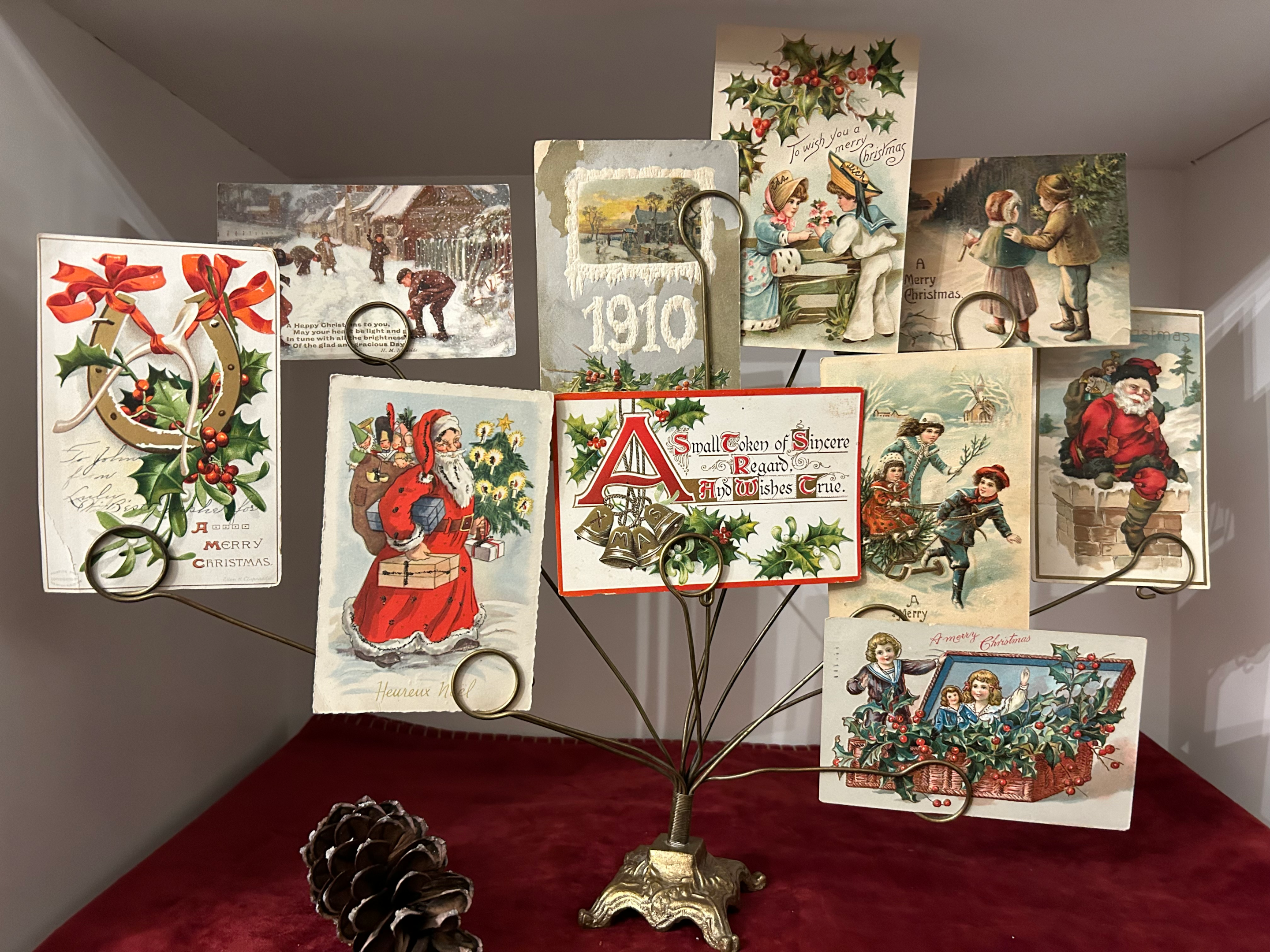 Displaying antique Christmas postcards