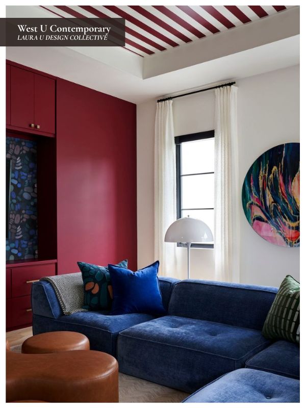 Family game room with a deep blue sectional, berry red built-ins, striped ceiling, and custom leather ottomans.