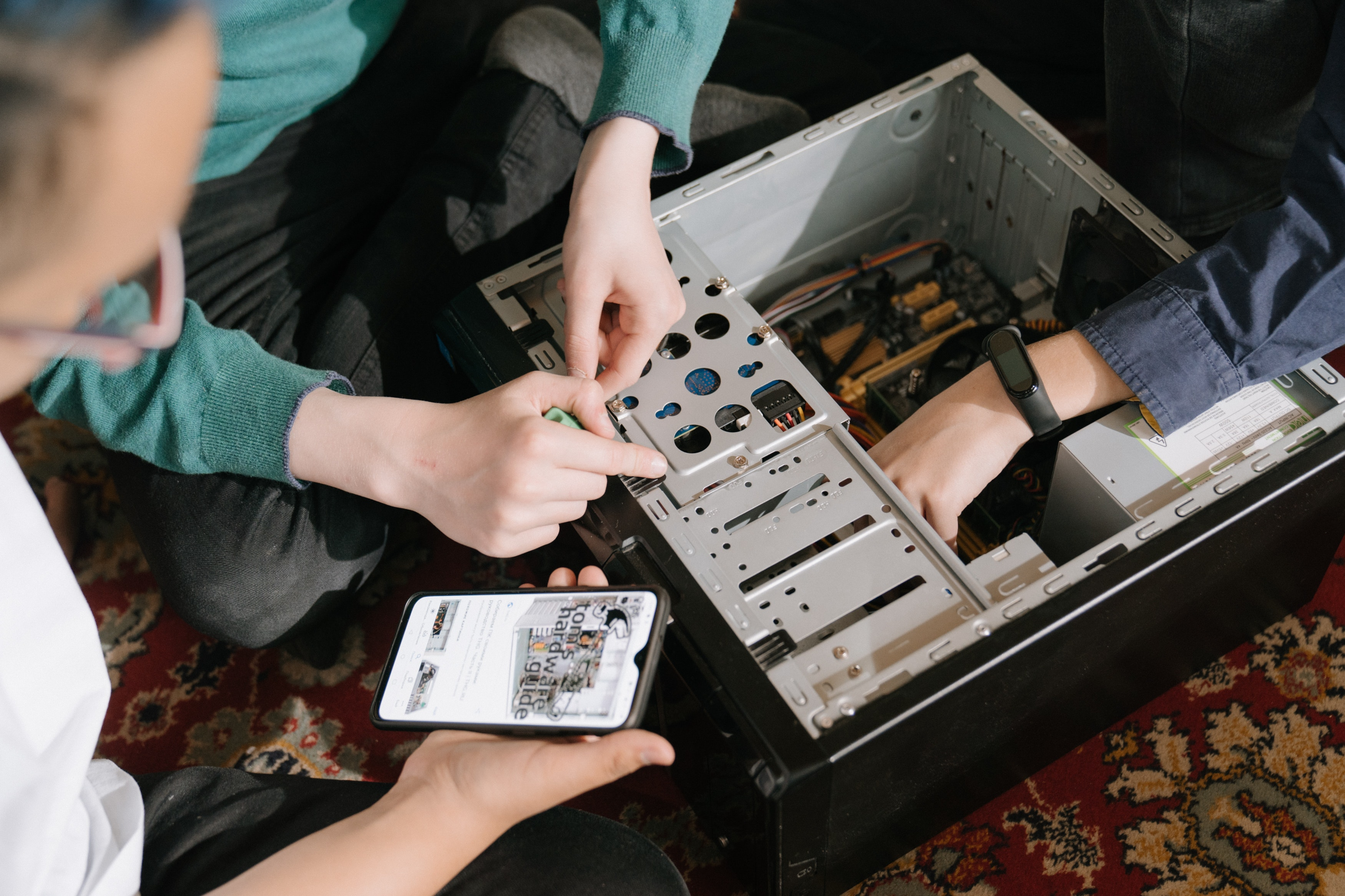 computer repair team fixing a unit