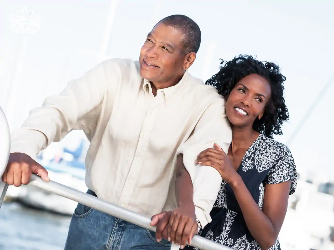 A mature couple enjoying a boat ride, symbolizing a loving relationship. Fabulous Flowers and Gifts. Romantic Flowers