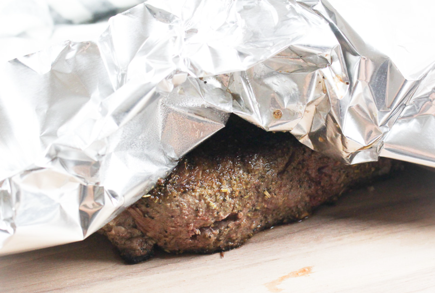 Marinating the meat or rubbing in dry spices before roasting gives it an extra depth of flavour. Try mixing dried herbs with brown sugar or honey for a caramelised twist, and make sure to rest the meat in a foil tent before serving.