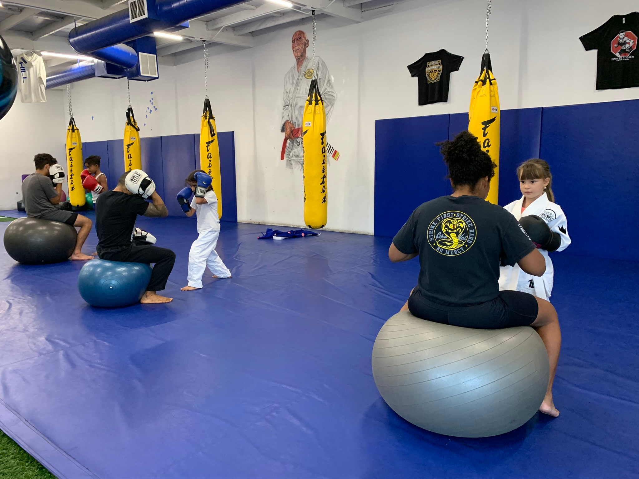 The students practicing punching techniques with the instructors. 