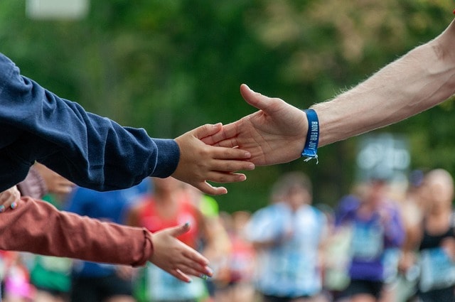 Two hands meeting, representing the idea of positive support.