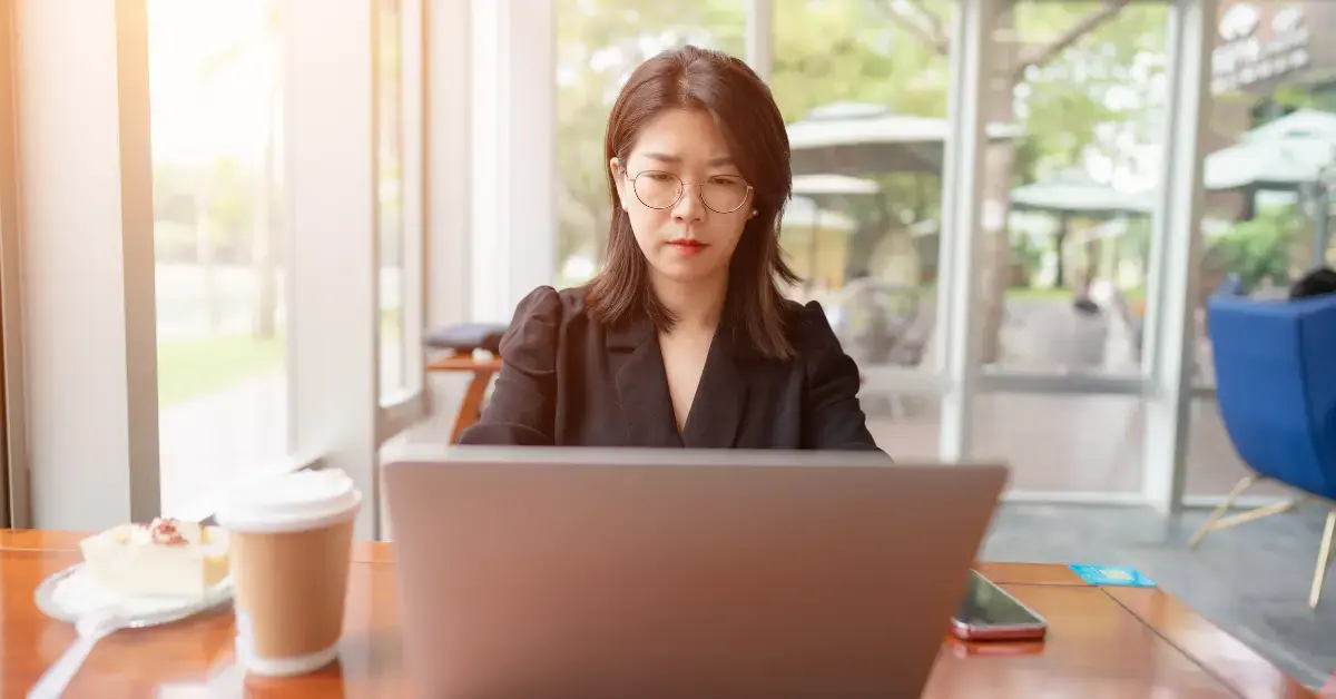 Woman managing EFTPS enrollment and scheduled IRS tax payments for self-employment income.