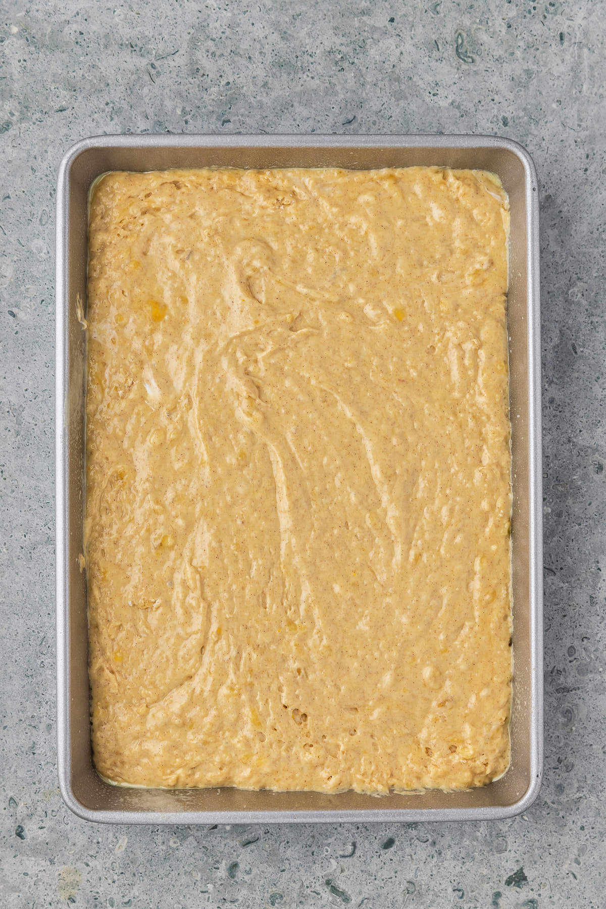 unbaked banana cake in a pan
