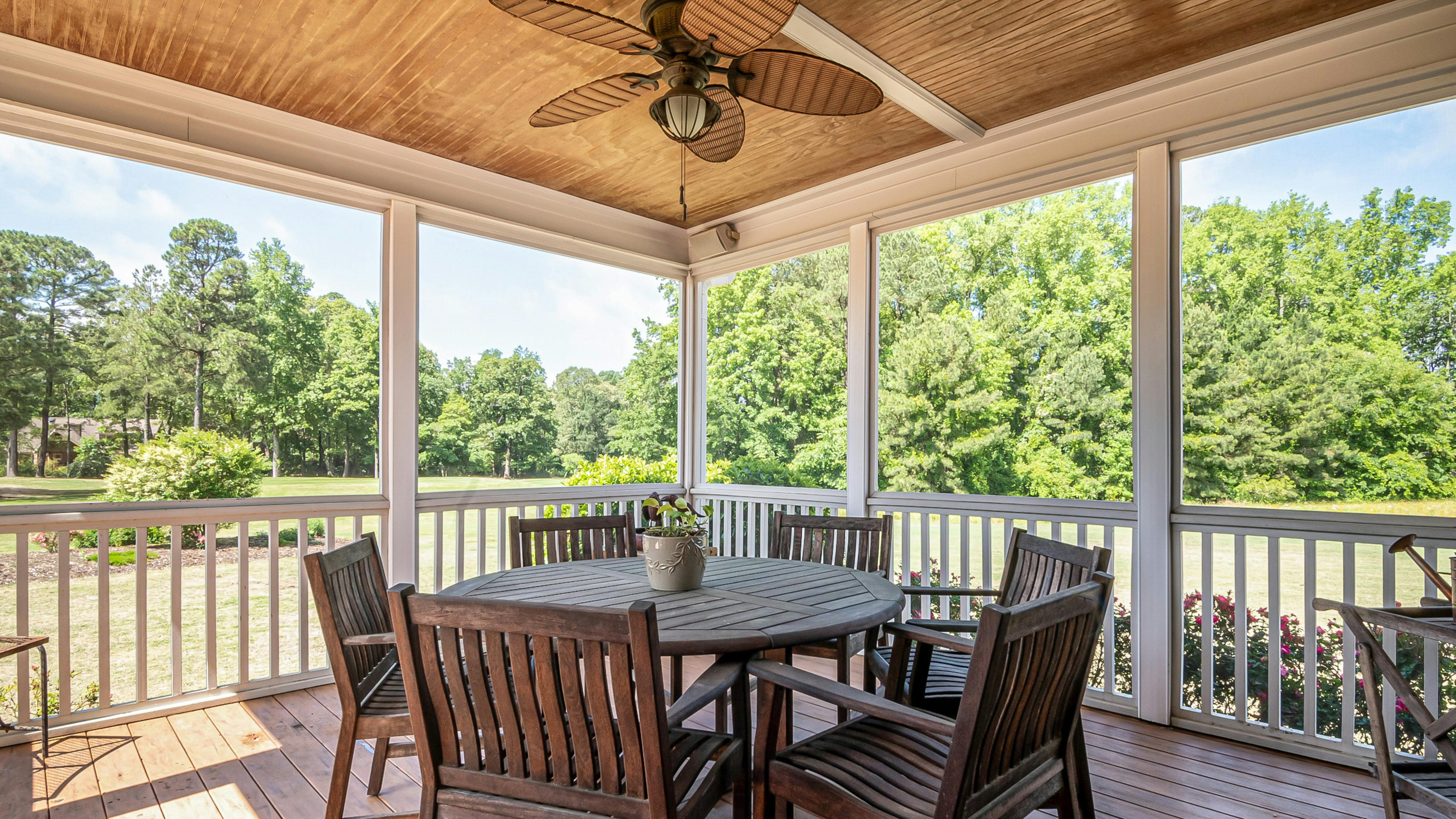 Outdoor Ceiling Fan with Five Wooden Blades in a Patio