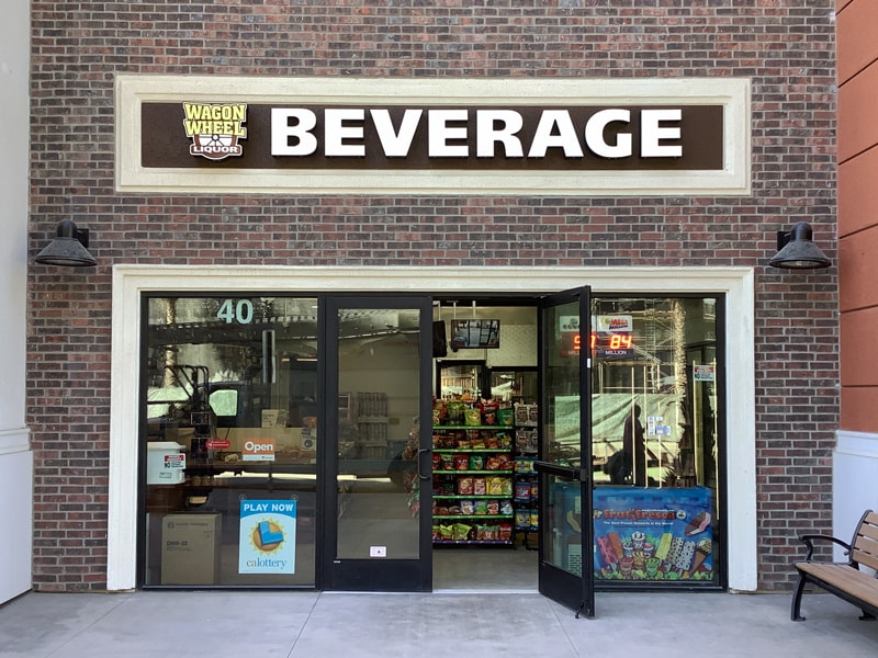 Illuminated channel letters make Wagon Wheel Beverage easy to spot and give the storefront a bold, modern look.