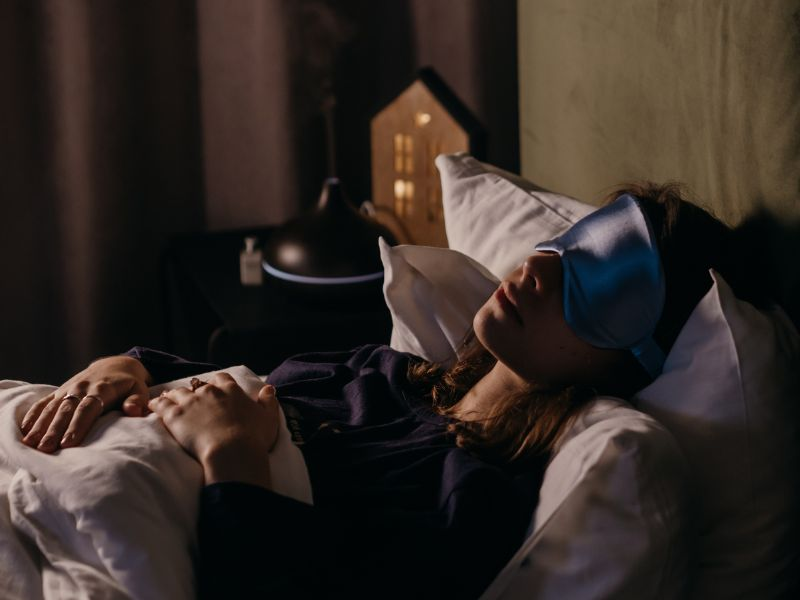 woman sleeping with mask