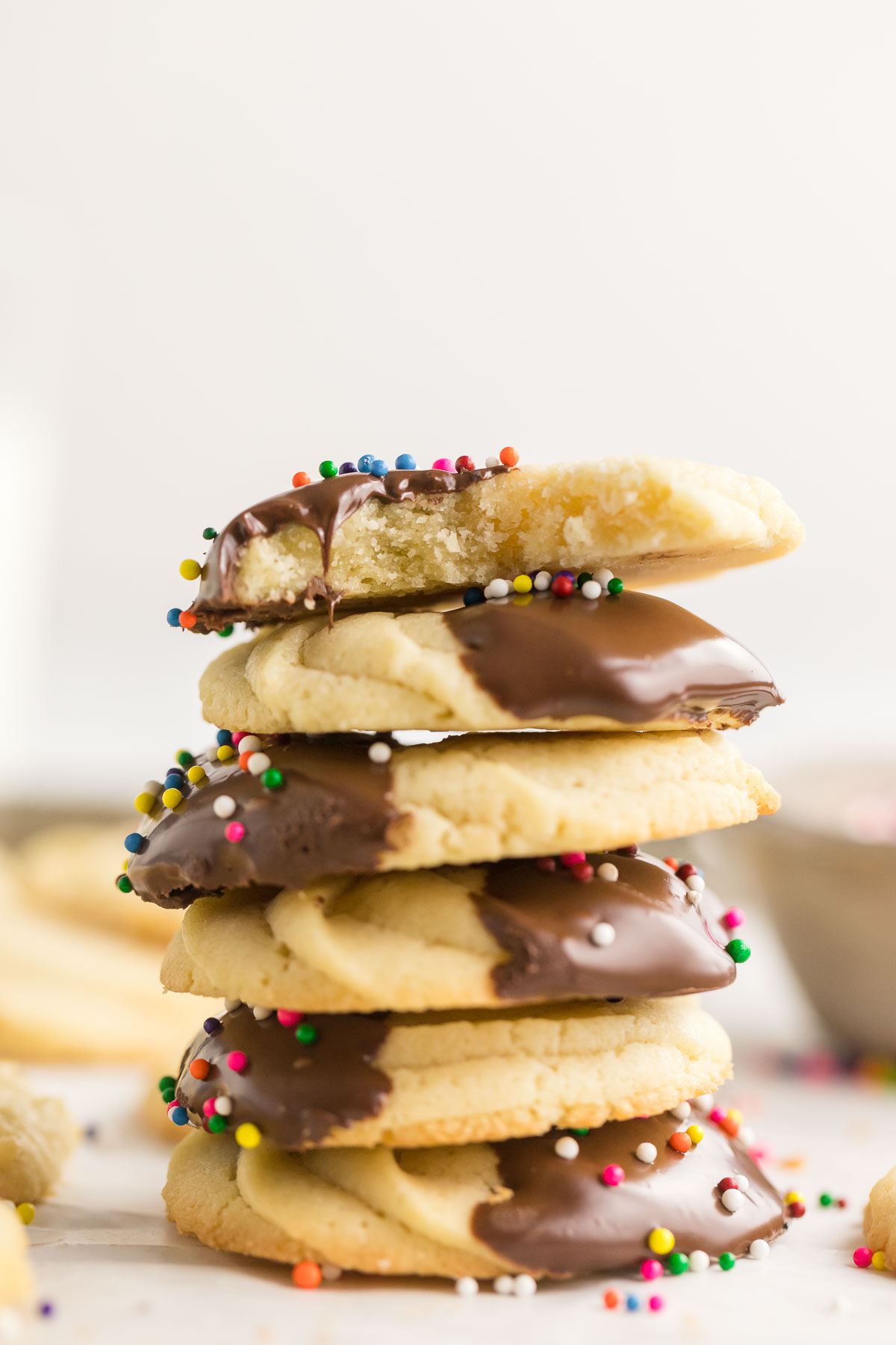 stack of chocolate dipped Danish butter cookies with sprinkles