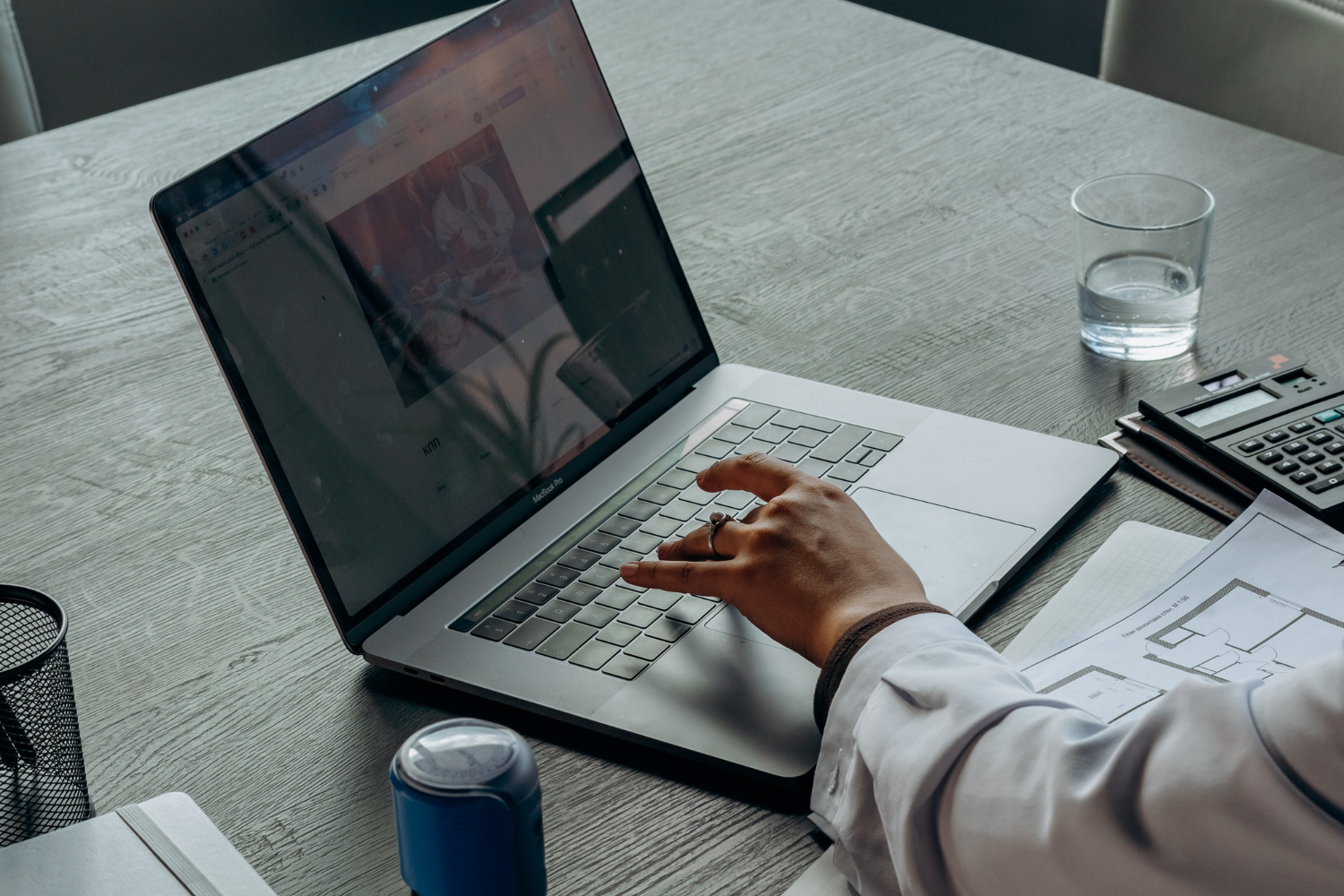 Person working on laptop.