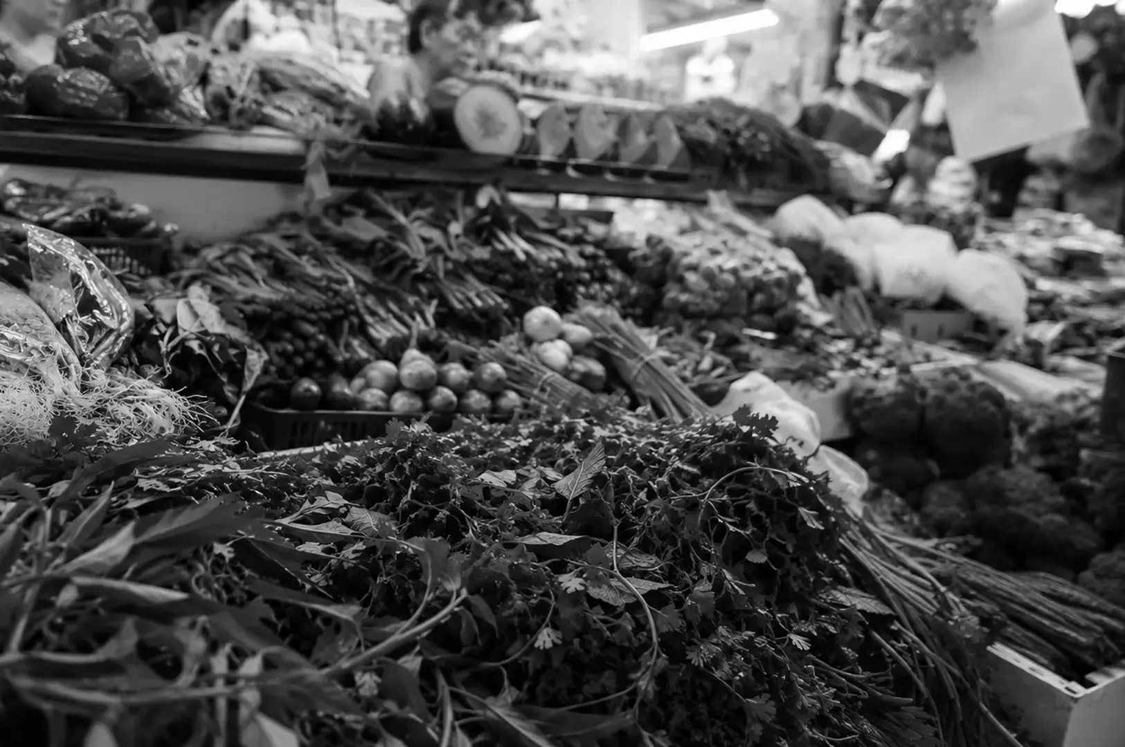 Local fresh produce at a market, where restaurants and consumers source seasonal ingredients.