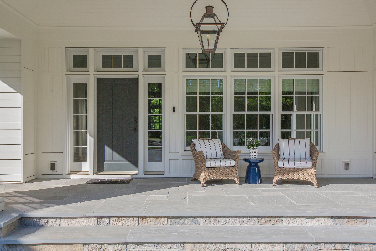 A freshly painted front porch door in a vibrant color, enhancing the home's curb appeal.