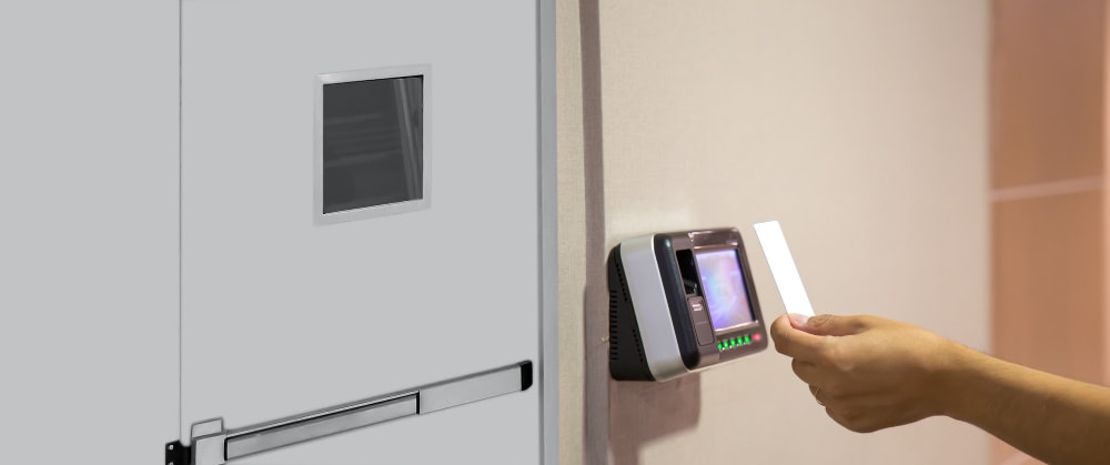 Office man using the id card at restricted areas to scan at the access control.