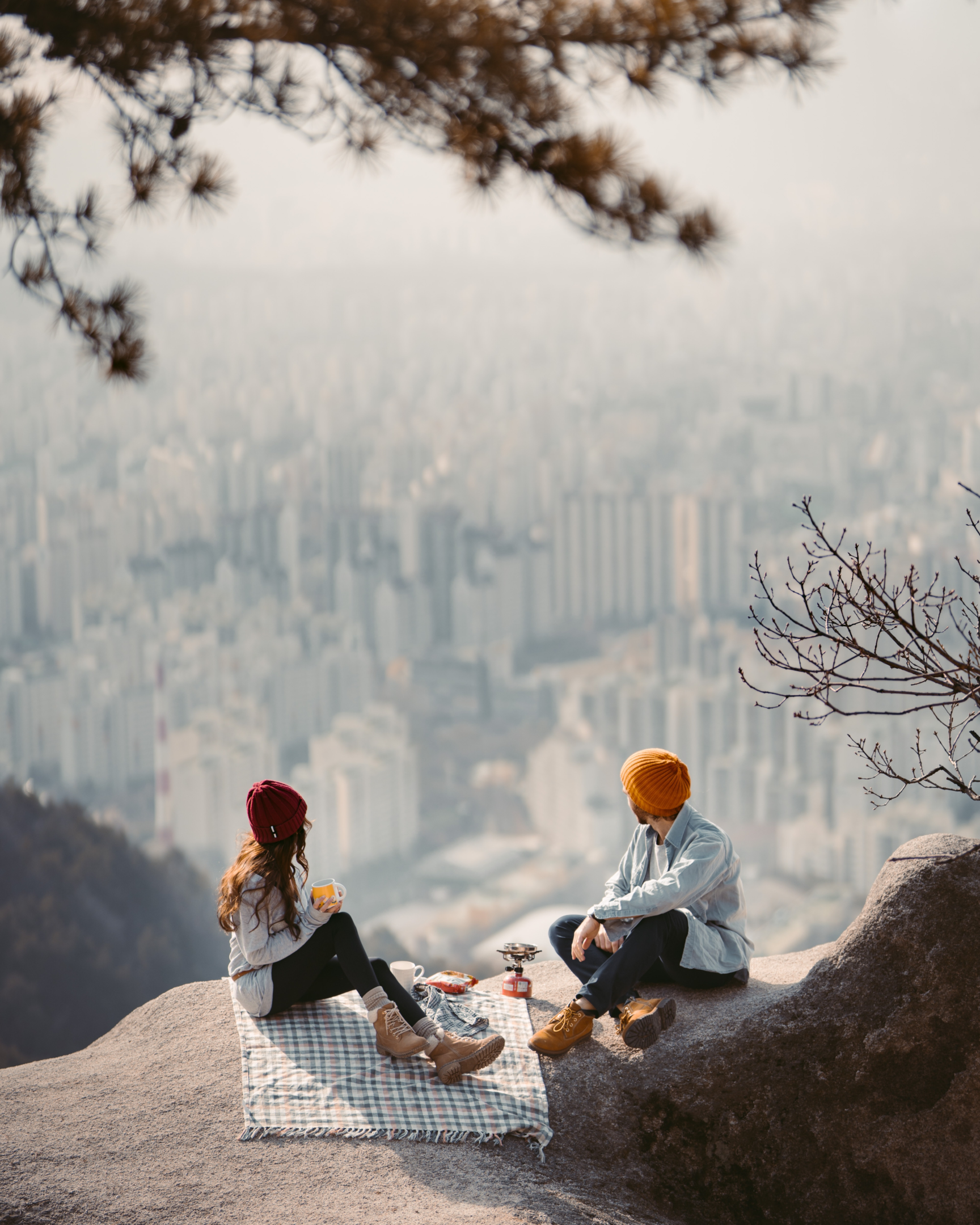 couple siting on blanket