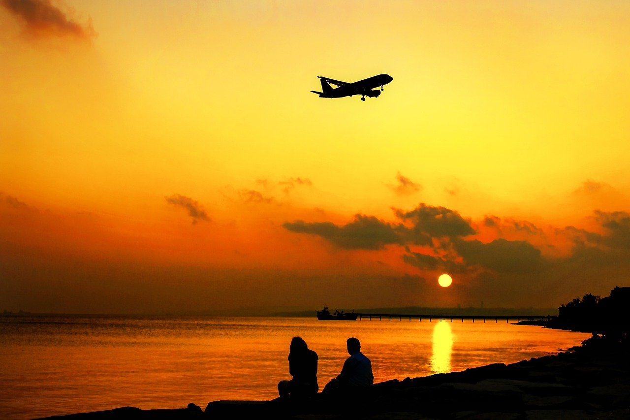 An aircraft taking off in sunset.