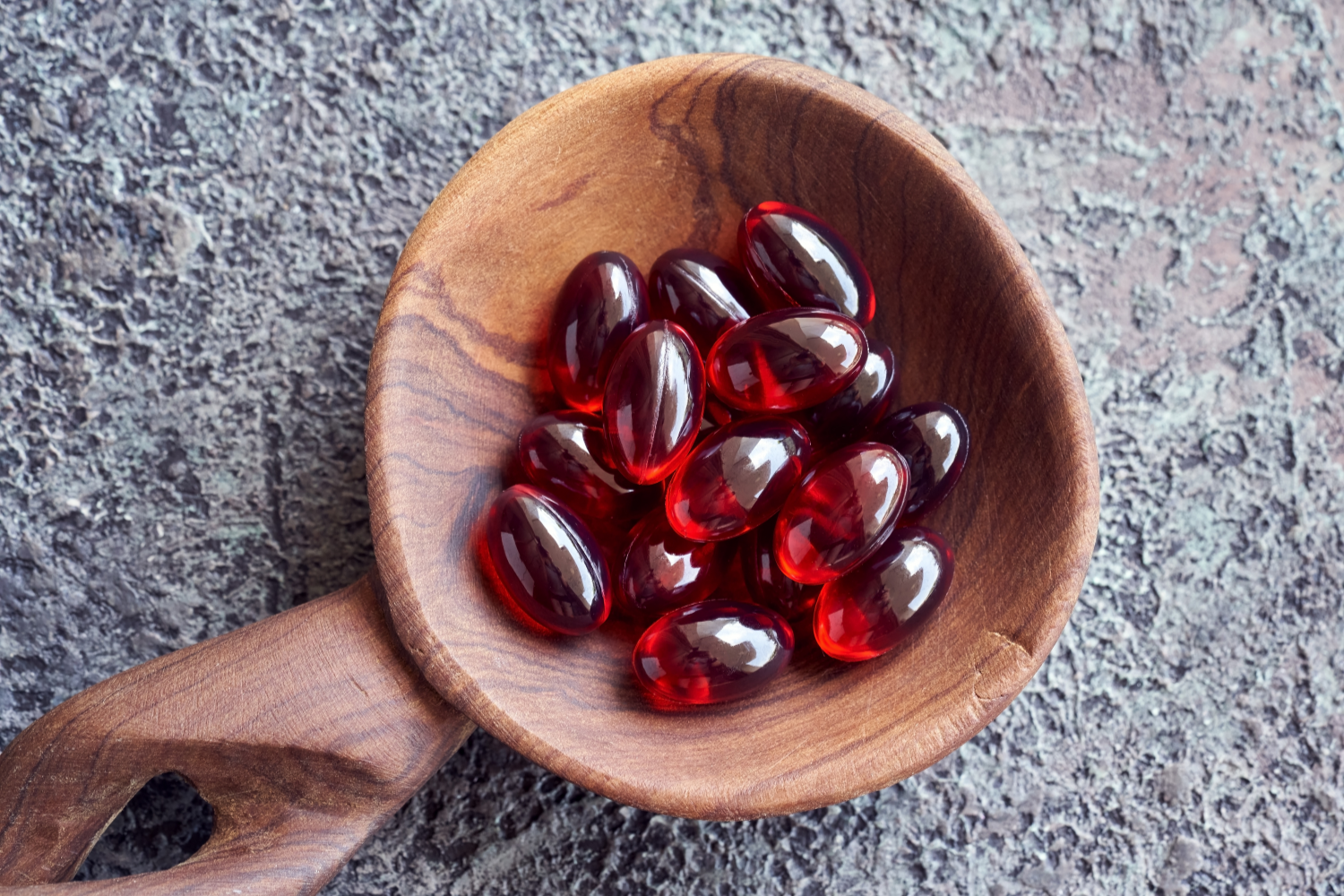Bowl of red softgels.