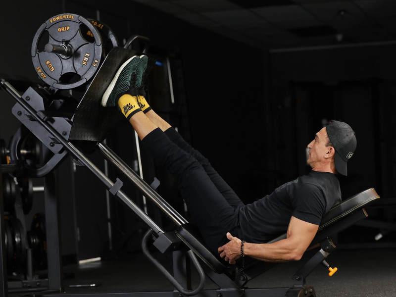 An image showing the Powertec Leg Press machine in a home gym setting.