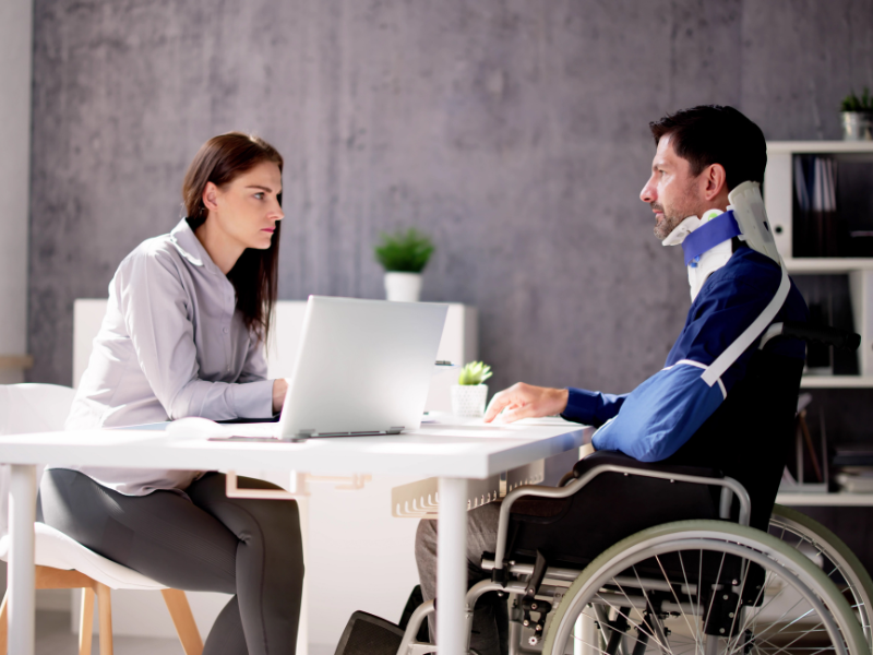 Image showing a person talking with a lawyer after being a victim of a hit and run offense.