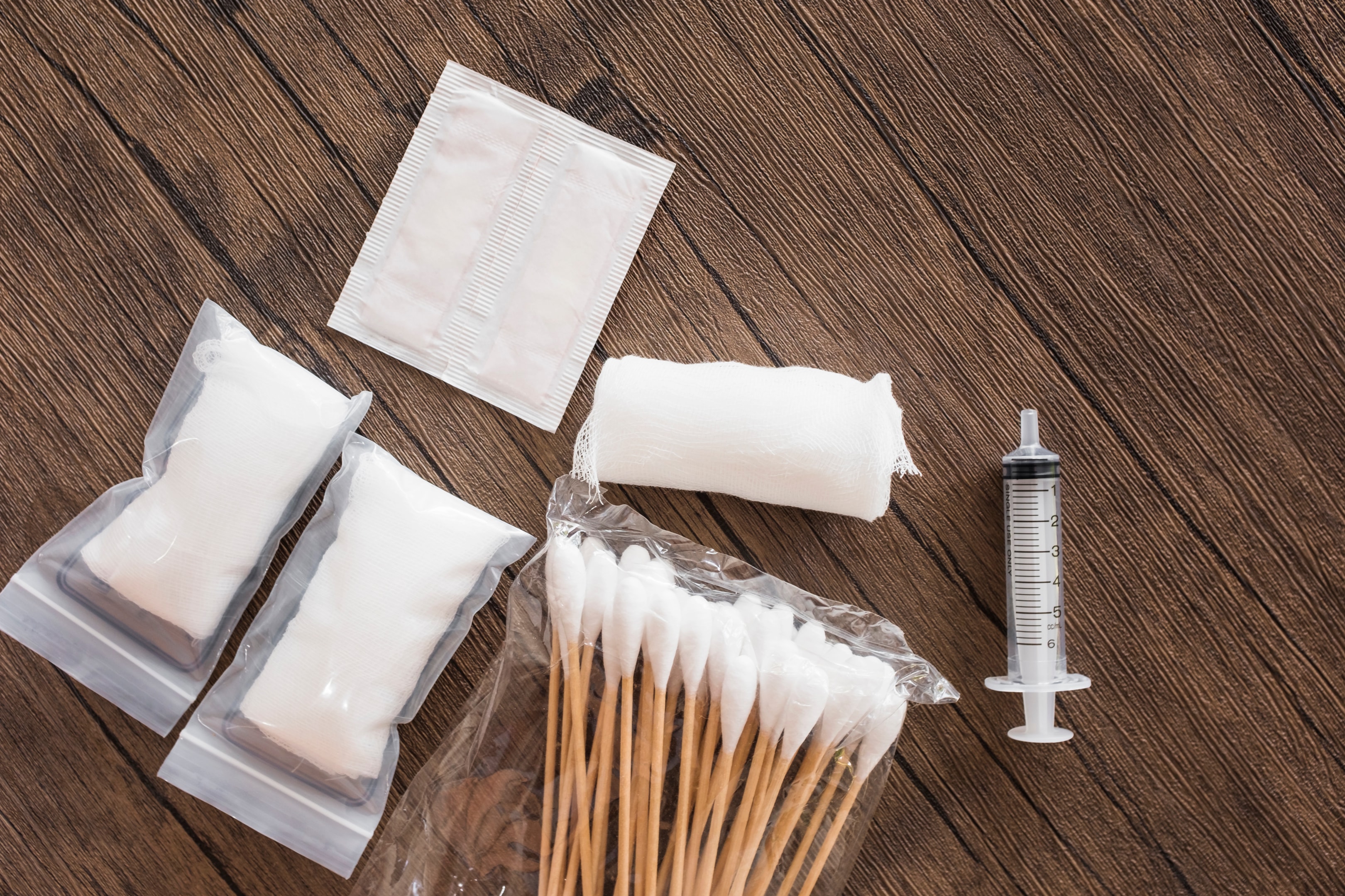  Gauze, cotton swabs, bandages, and a syringe for emergencies.                                       (Designed by Freepik) 