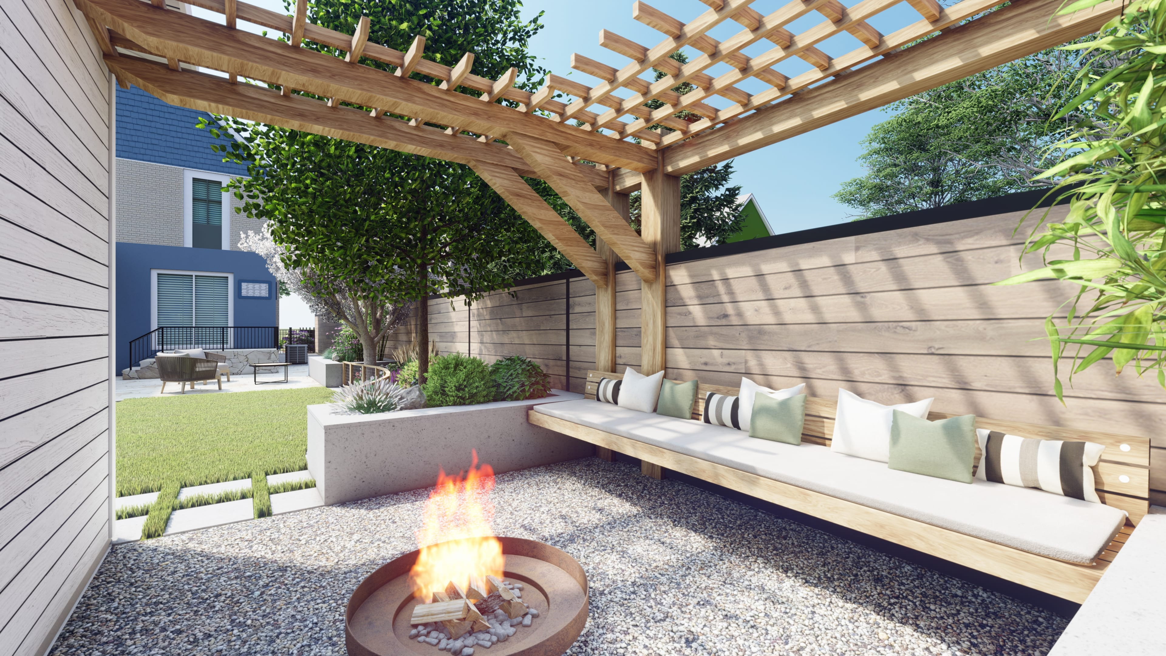 A landscape design with gravel fire pit area, turf grass and a patio