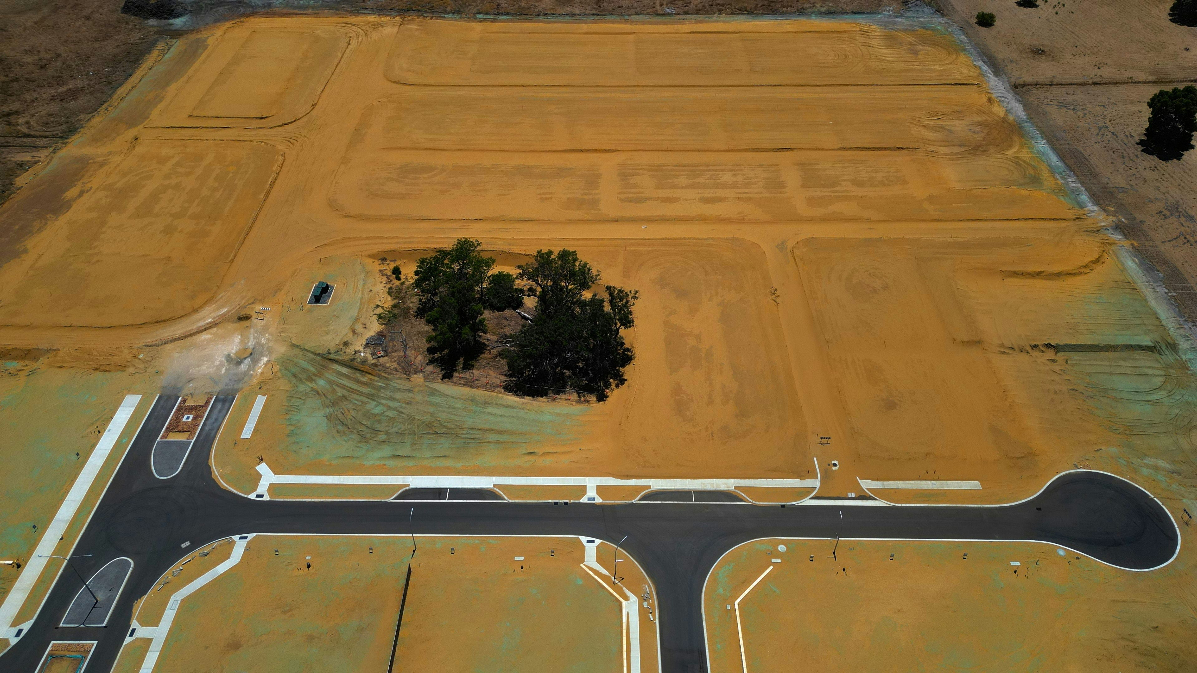 Aerial view of vacant land owned by real estate investor and ready for development.
