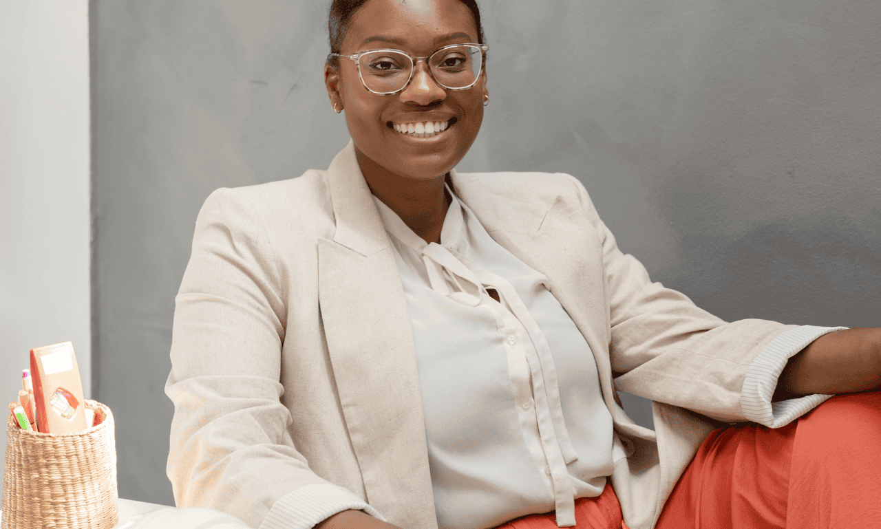 A real woman looking at camera and smiling.