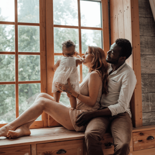family beside a window