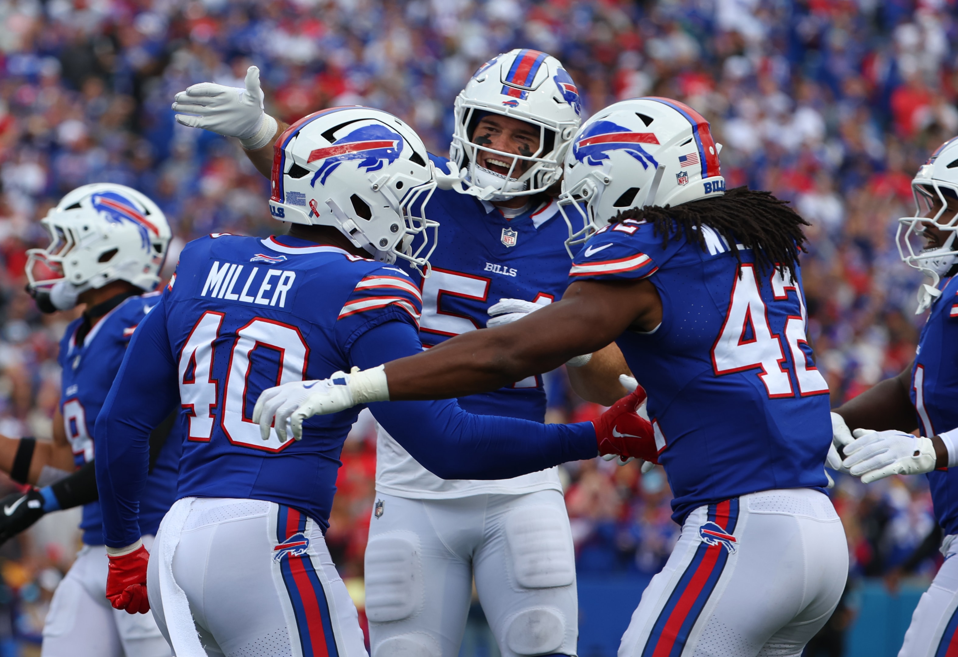 Baylon Spector, Von Miller and Dorian Williams of the Buffalo Bills react after a play at Highmark Stadium on September 8, 2024 in Orchard Park, New York. 