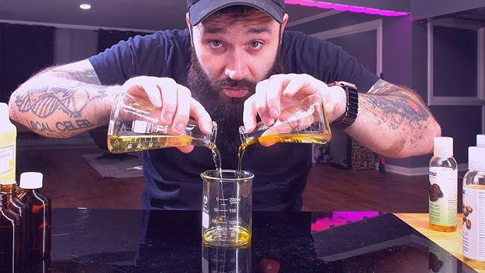 A person blending oils to make beard oil with nature resources using traditional technology