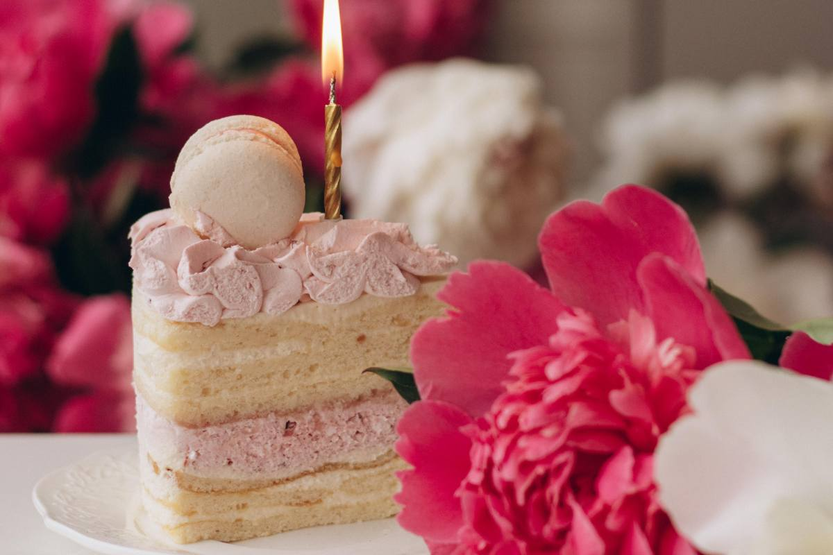 slice of moist pink cake with peonies celebrating birthday wishes for a happy birthday for such a dear friend