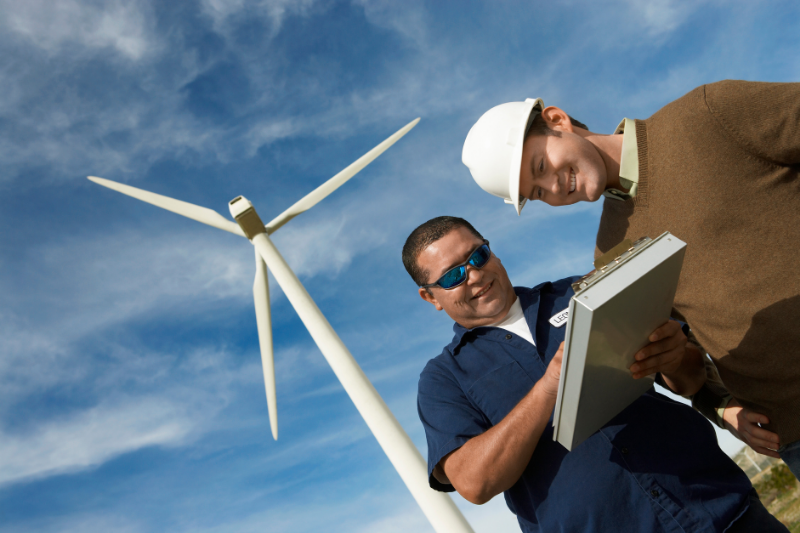 men working at a wind turbine on a wind farm