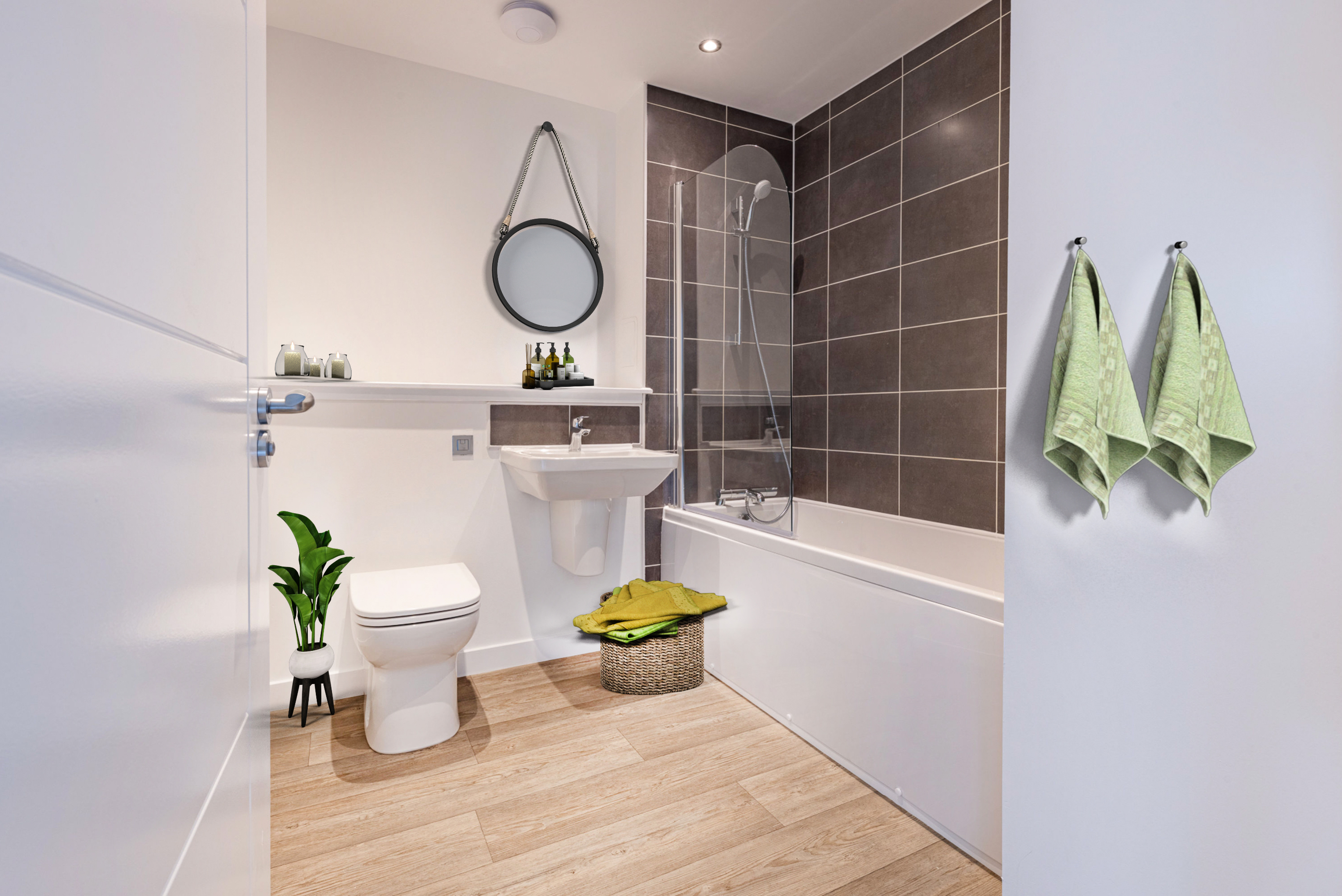 Styled bathroom in Edinburgh home development, featuring oak floors and green accessories 
