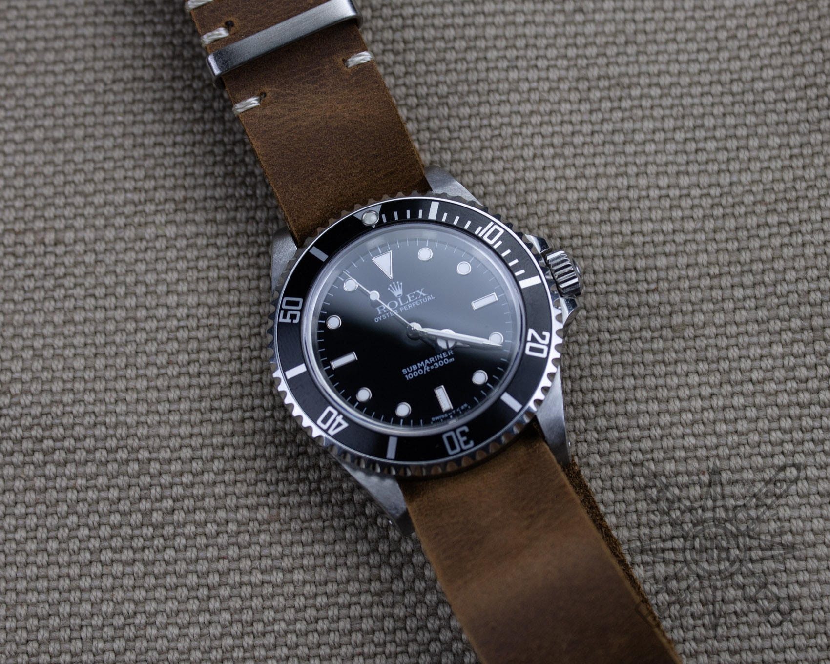 Close-up of a full-grain leather watch strap highlighting its texture and craftsmanship.