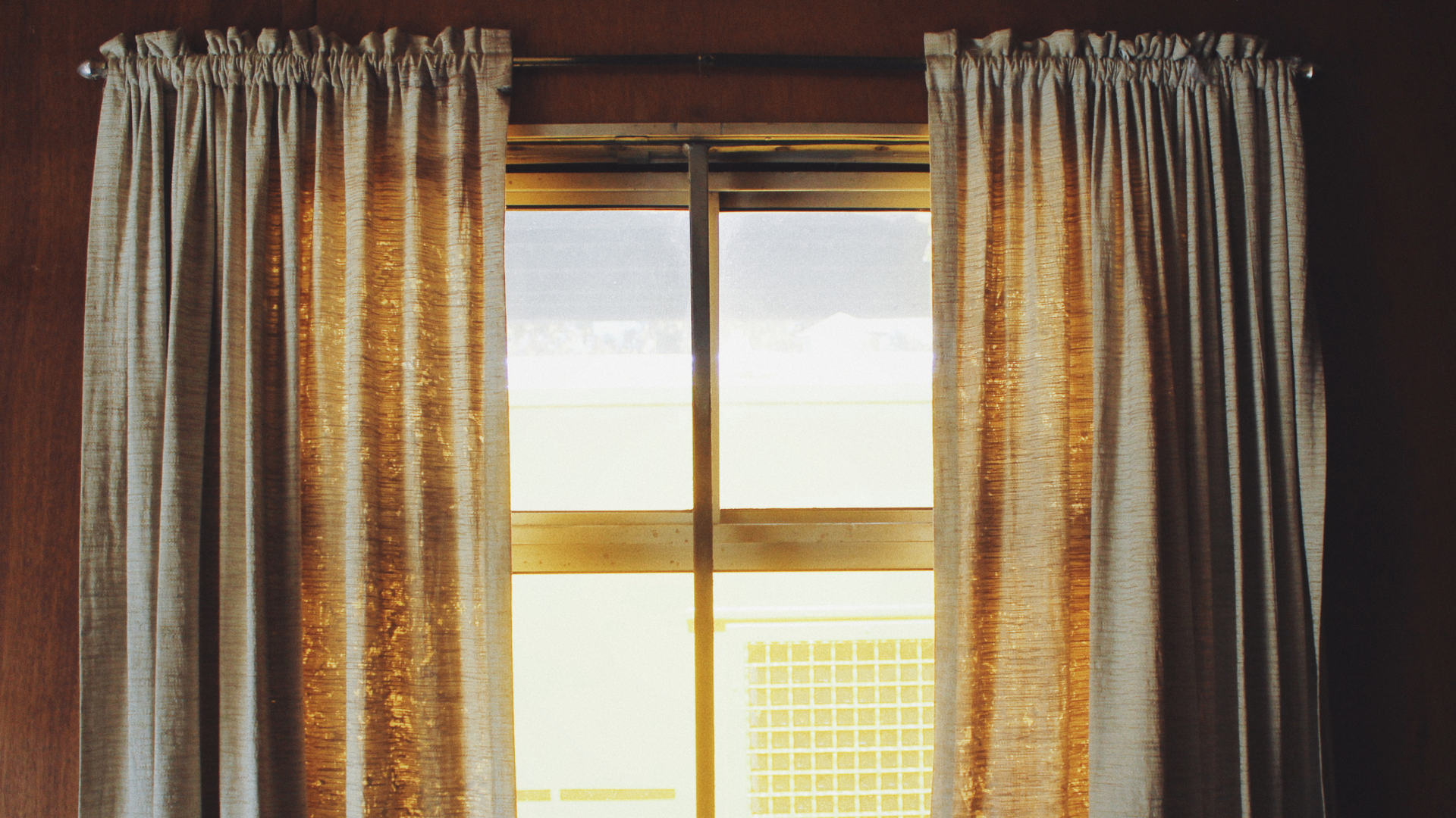 Curtain poles - half open rustic curtains on ball-finial metal pole 
